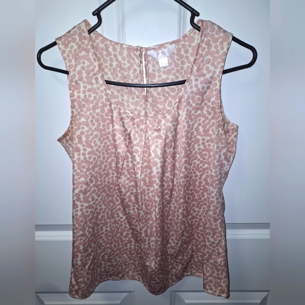 A Banana Republic ladies sleeveless cheetah print top in a size petite small.